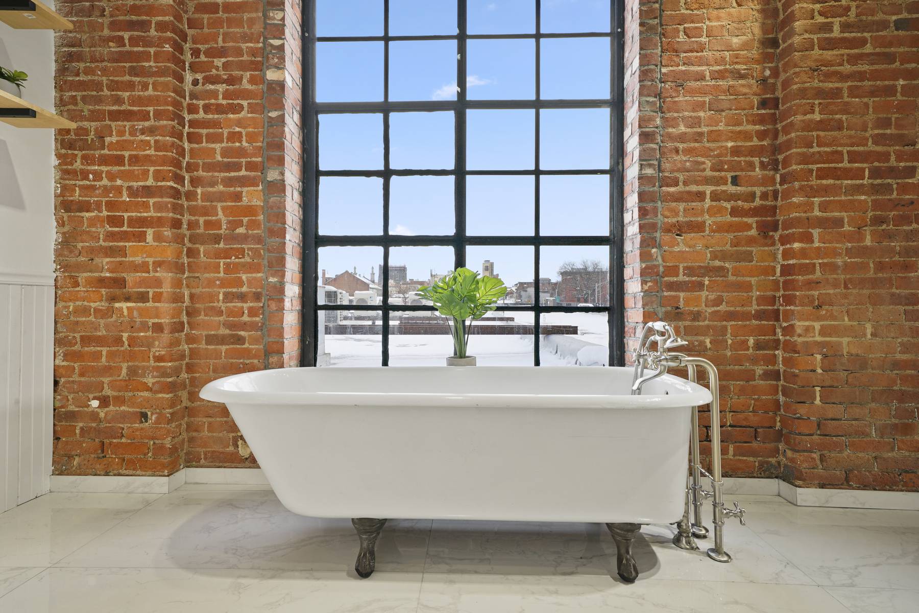 bath tub next to a big window overlooking the city - photo studio setup