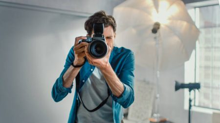 Photographer holding a camera about to shoot