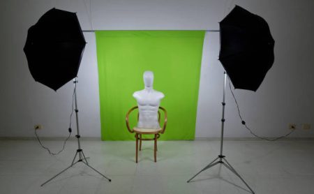 Cyclorama photo studio with a doll on film set