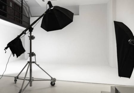 White photo studio interior background, cyclorama structure and professional impulse lights